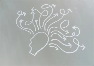 Illustrasjon som symboliserer ADHD og nevrodiversitet, med en hodeform og piler som går i mange retninger og representerer mangfoldige tankeprosesser.
